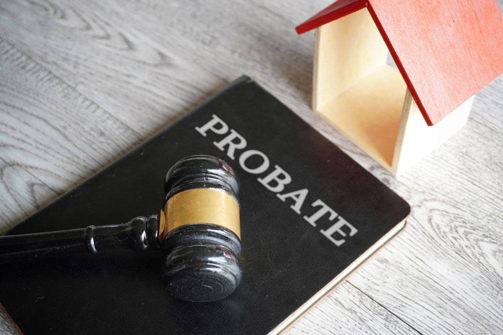 Toy house, gavel and text PROBATE